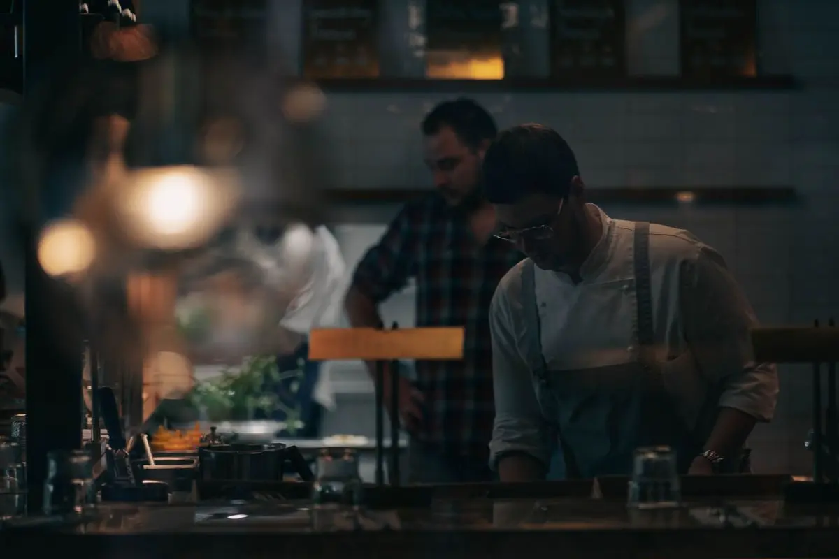 Colleagues working behind a restaurant bar