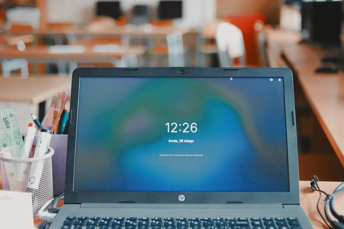 A laptop on a classroom desk