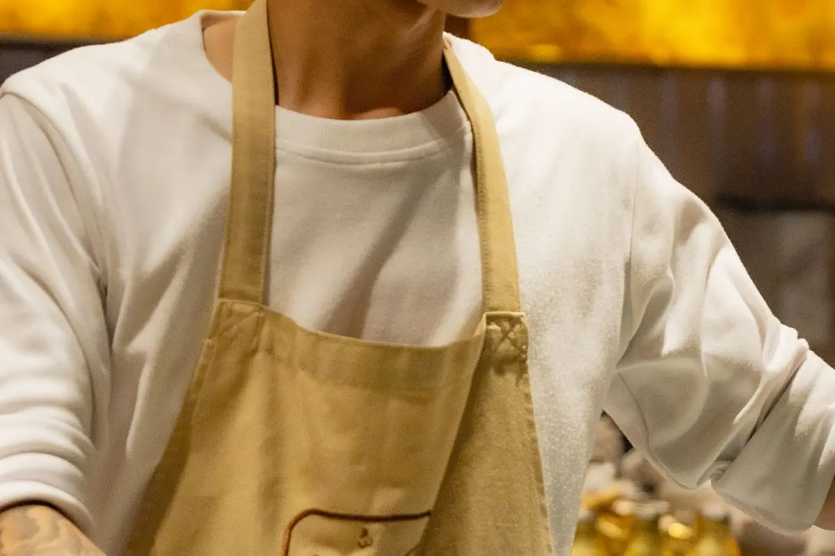 A chef preparing a dish in a professional kitchen