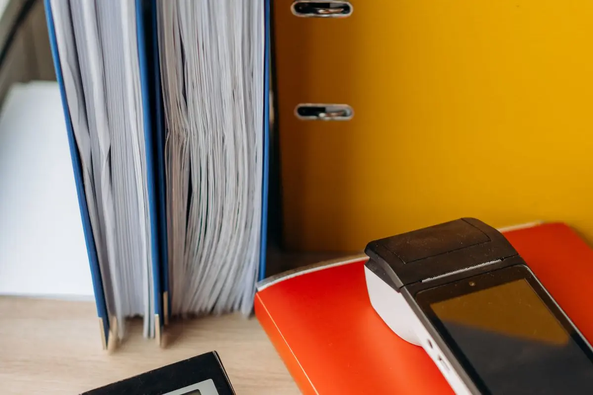 A calculator beside financial documents
