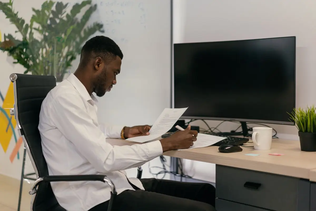 An office worker reviewing information at a desk